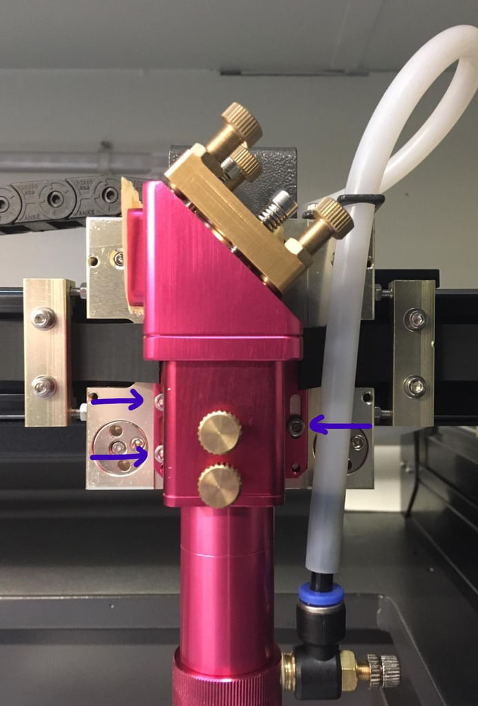 Laser head adjustment slots